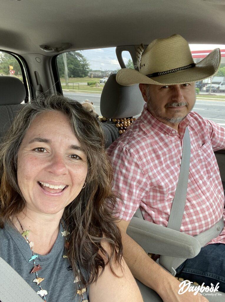 two people in truck traveling