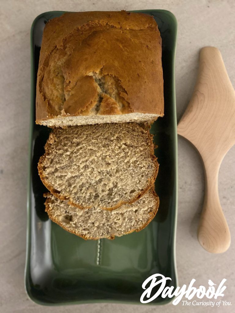 banana bread sliced on a green platter