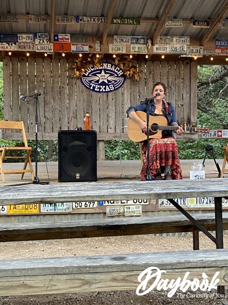 Sam Watson on stage with her guitar