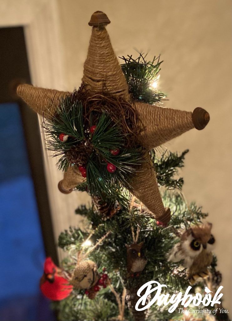 natural rope star on top of Christmas tree
