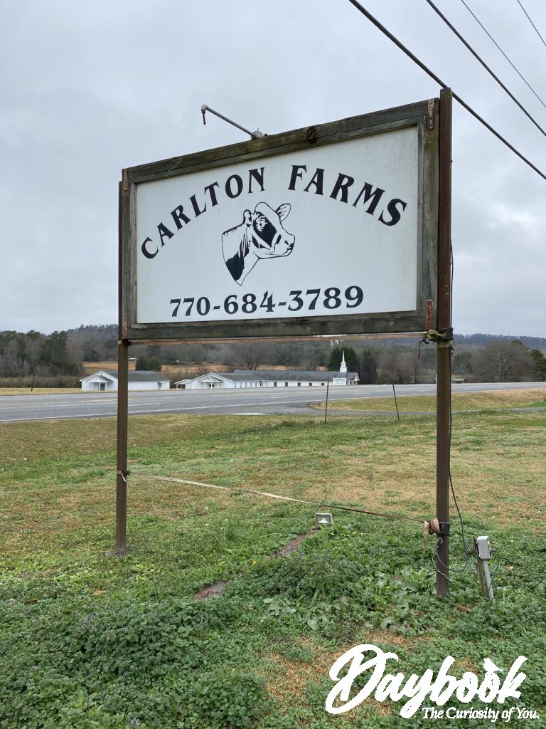 Entrance sign to a local farm called Carlton Farms