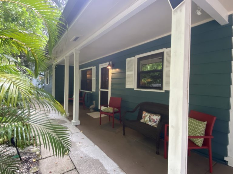 A view of the front porch of a ranch style home in Sarasota Florida