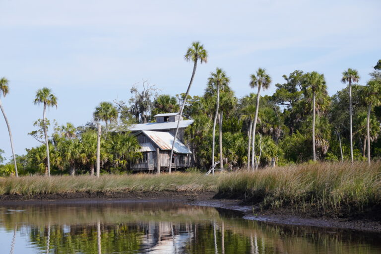 An old river house just off the water's edge